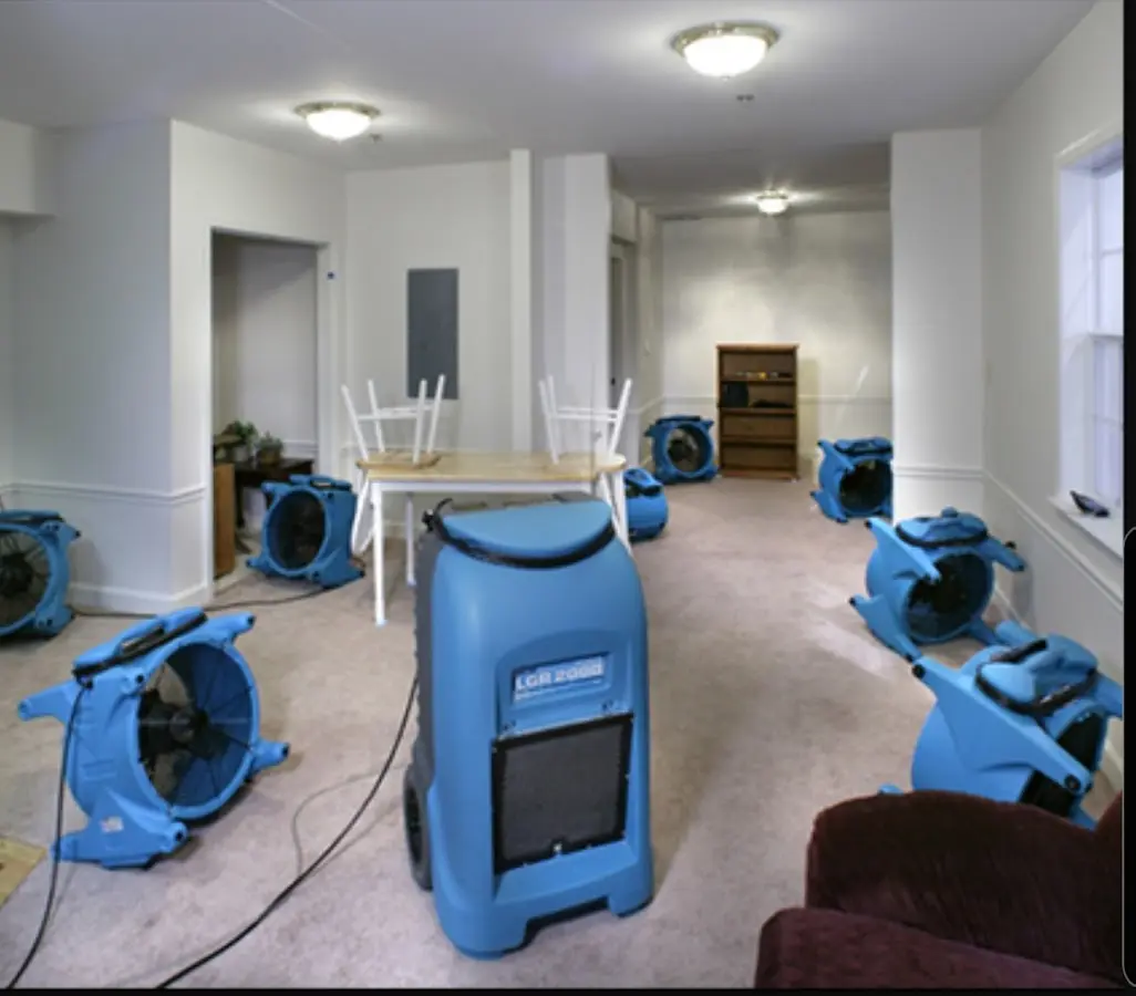 Air movers and dehumidifier setup for Water Damage Restoration in Galliano